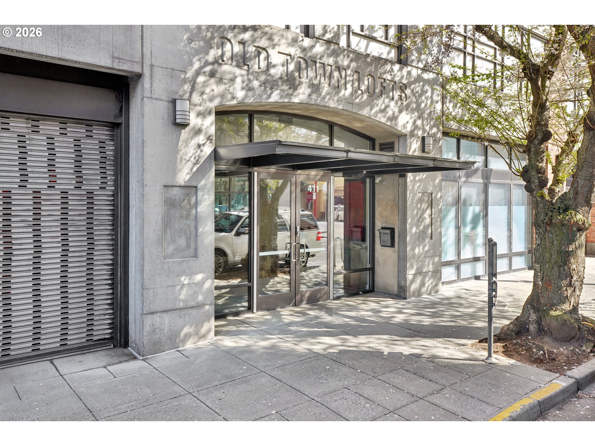 411 Northwest Flanders Street, Unit 302 Portland, OR 97209 - Photo 3 of 41 a black and white building with a outdoor space