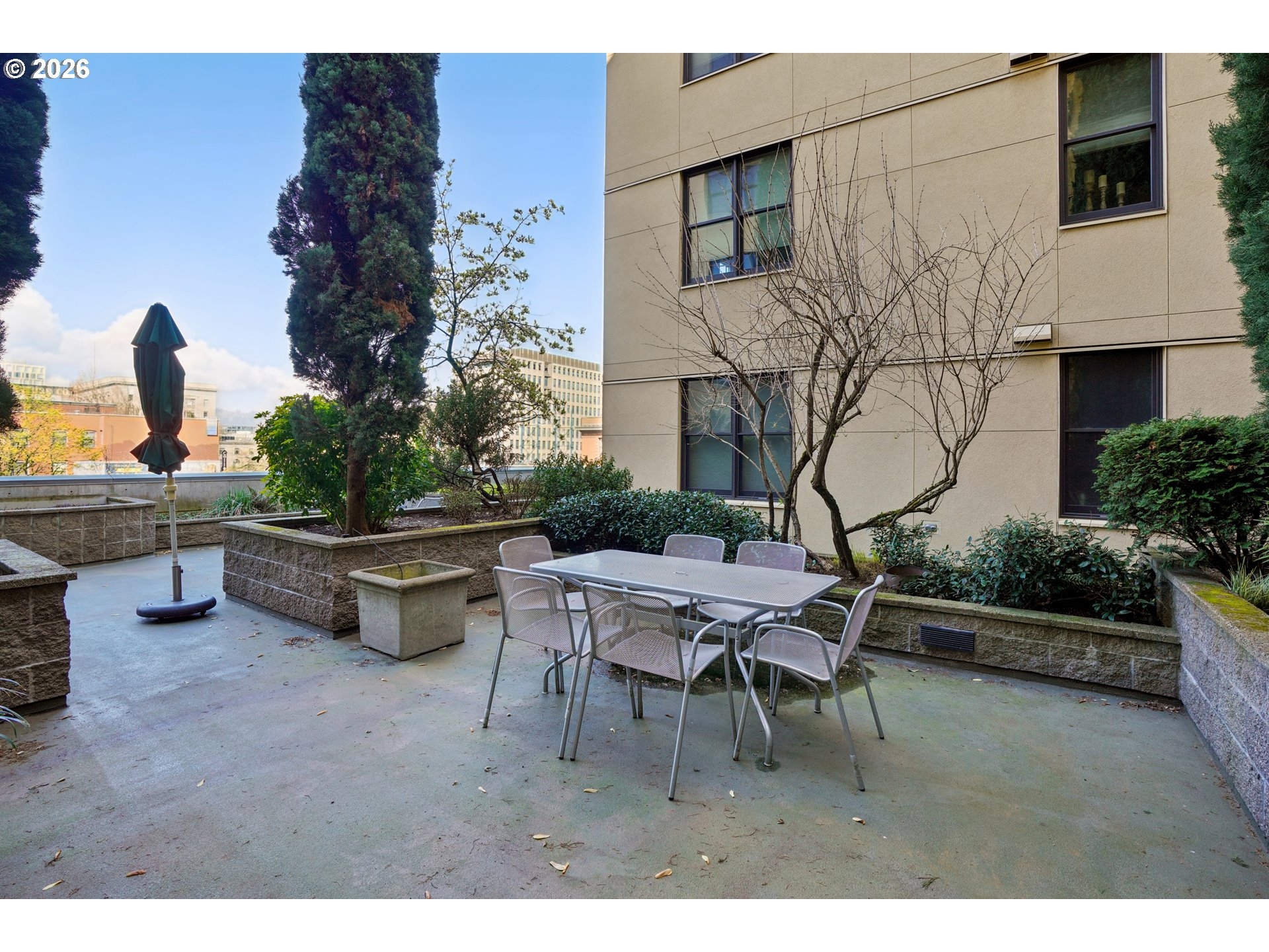 411 Northwest Flanders Street, Unit 302 Portland, OR 97209 - Photo 33 of 41 a building outdoor space with patio furniture and potted plants