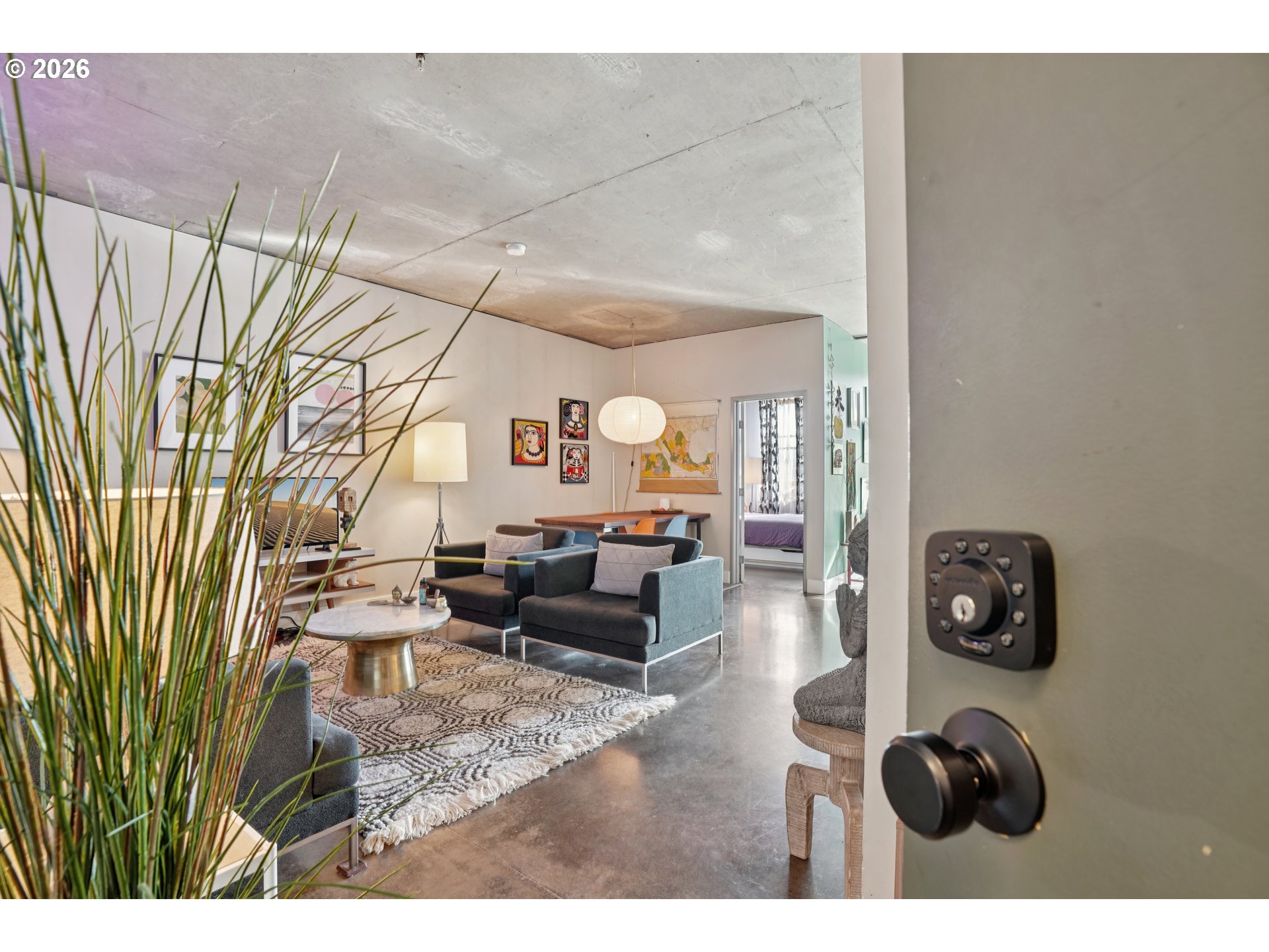 411 Northwest Flanders Street, Unit 302 Portland, OR 97209 - Photo 5 of 41 a living room with furniture and a wooden floor