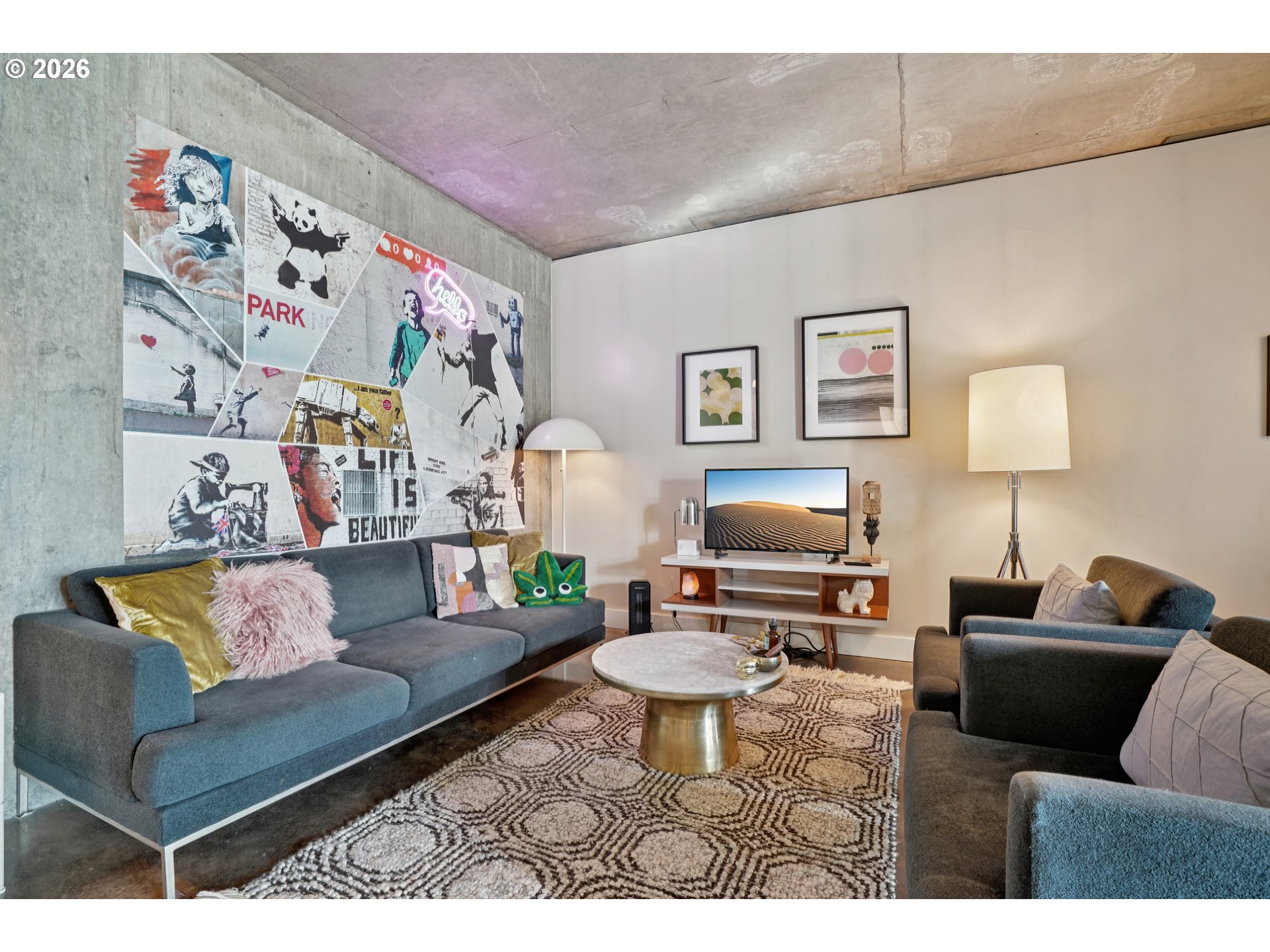 411 Northwest Flanders Street, Unit 302 Portland, OR 97209 - Photo 6 of 41 a living room with furniture and a couch