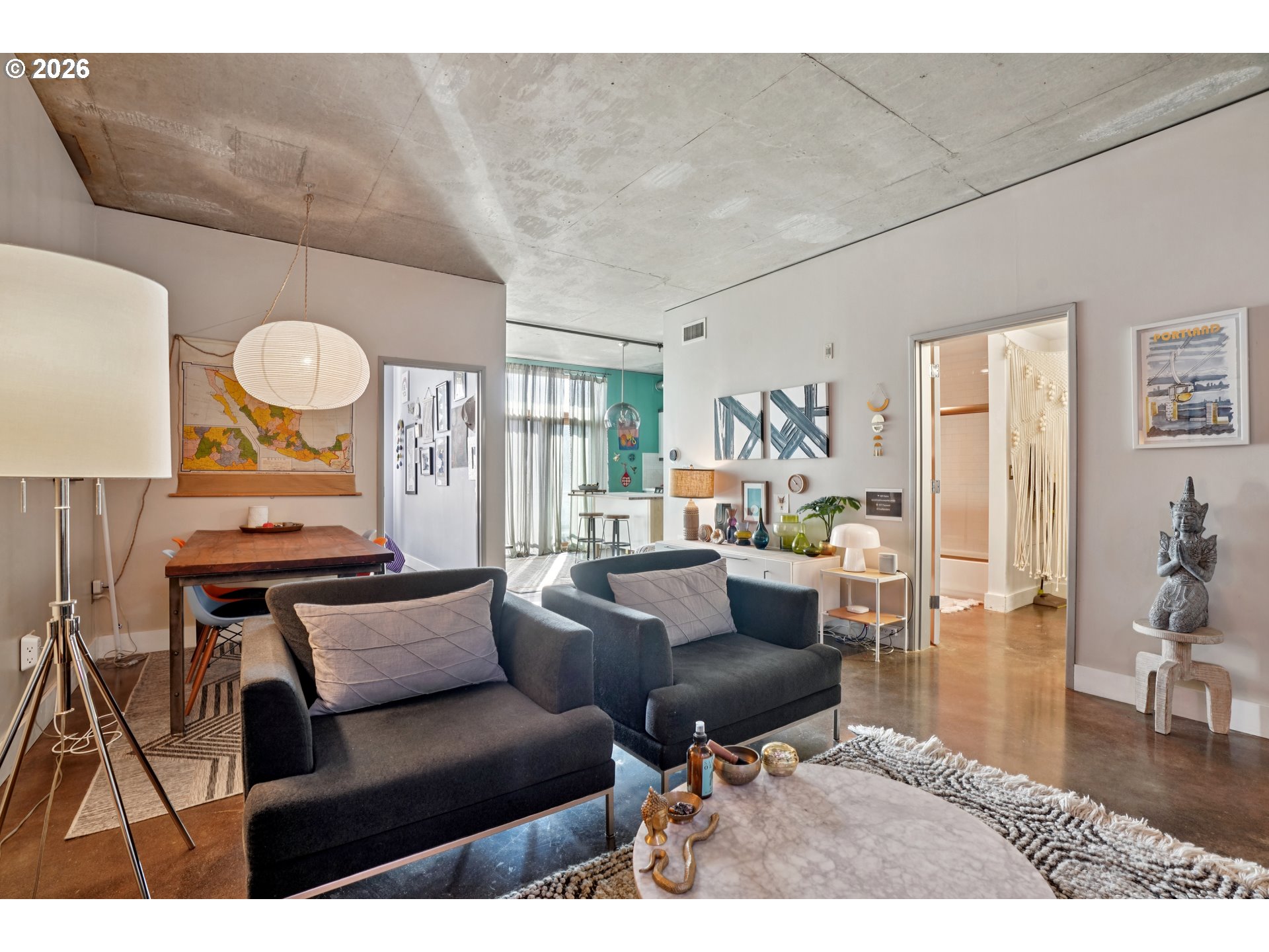 411 Northwest Flanders Street, Unit 302 Portland, OR 97209 - Photo 8 of 41 a living room with furniture and a large window
