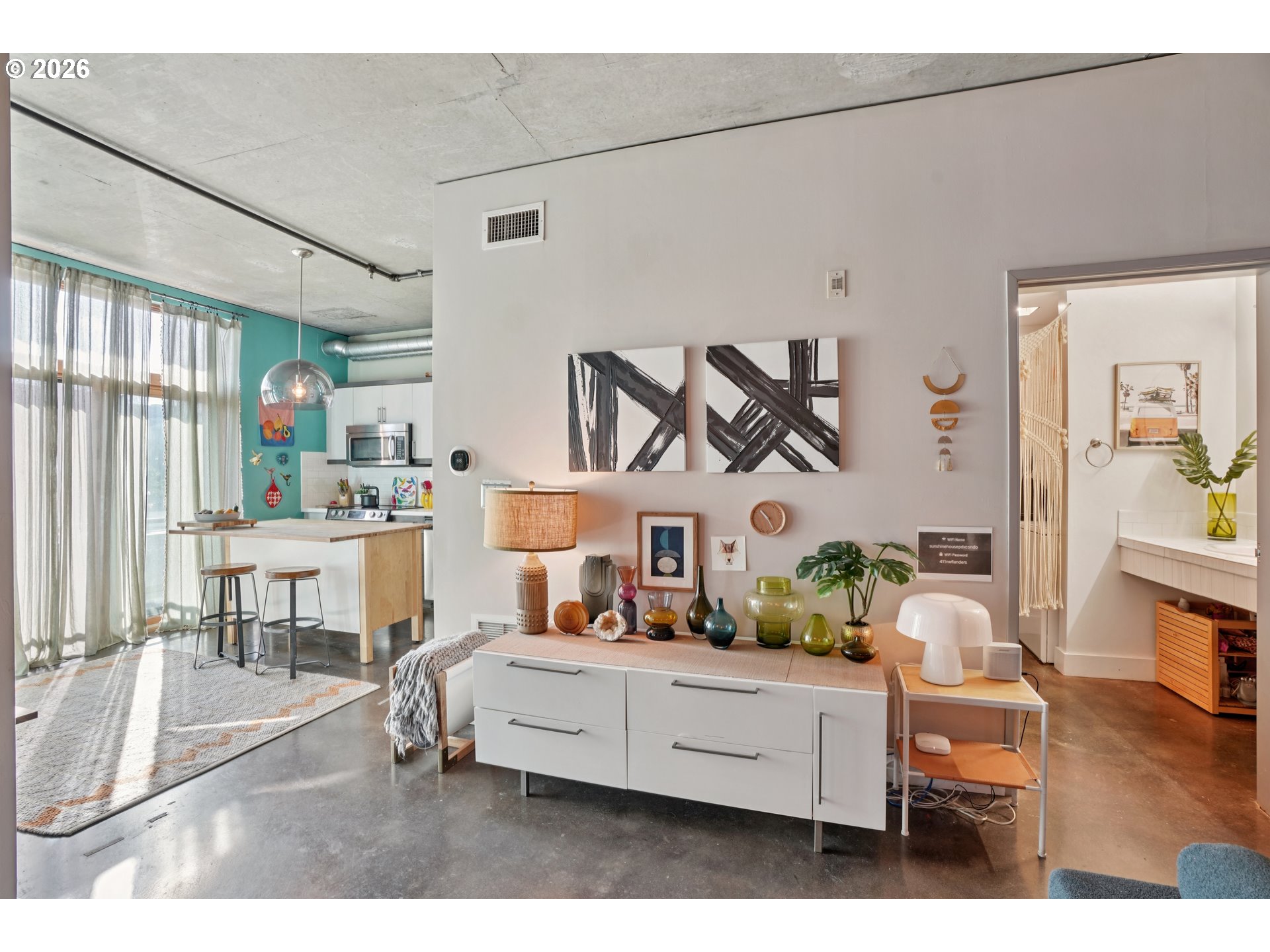 411 Northwest Flanders Street, Unit 302 Portland, OR 97209 - Photo 10 of 41 a living room with furniture and a table