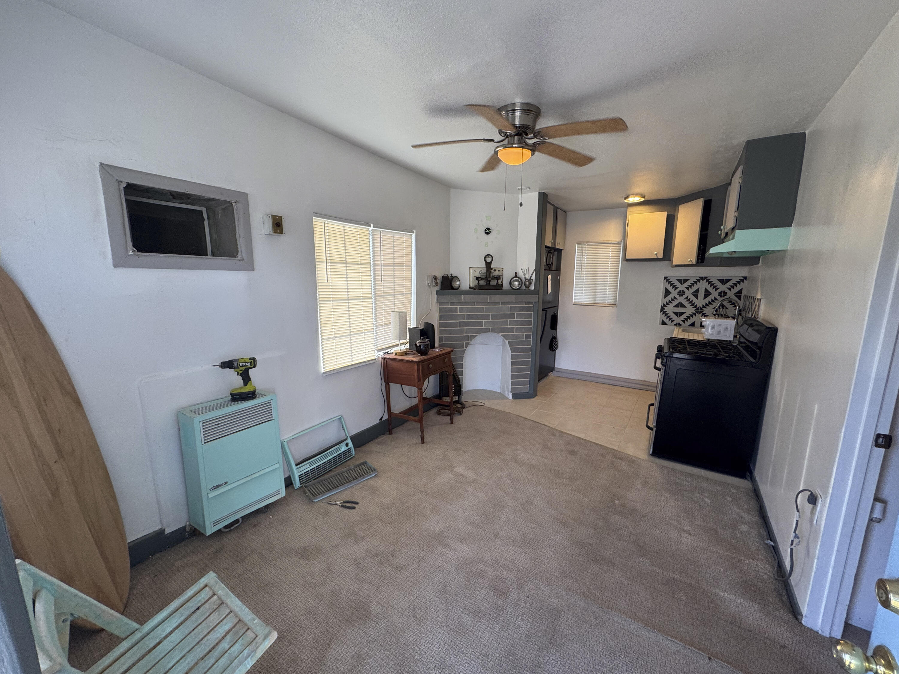 6746 Adobe Road, Unit 13 Twentynine Palms, CA 92277 - Photo 1 of 5 a living room with furniture and a window