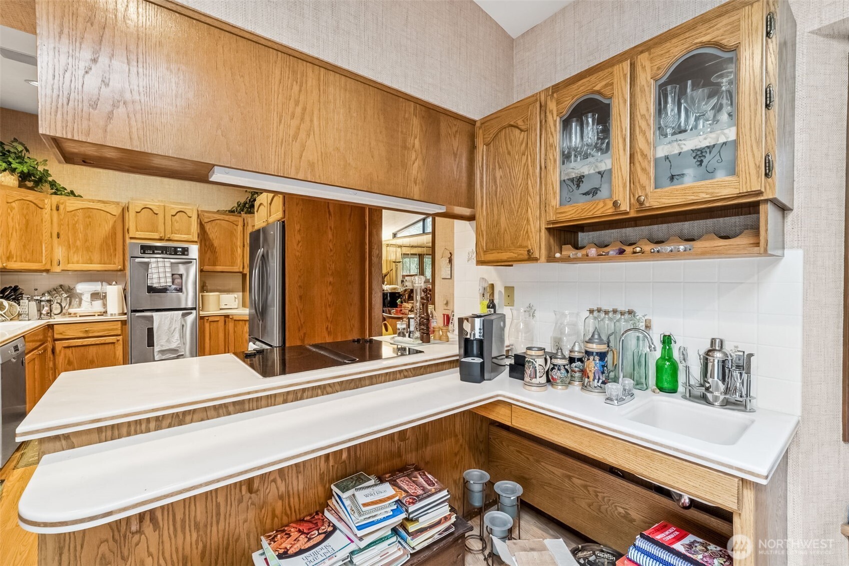 29722 Southeast Kent Kangley Road Ravensdale, WA 98051 - Photo 11 of 28 a living room with stainless steel appliances kitchen island granite countertop furniture and a kitchen view
