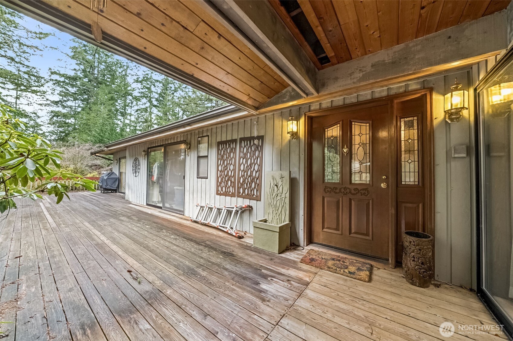 29722 Southeast Kent Kangley Road Ravensdale, WA 98051 - Photo 4 of 28 a porch with seating space and entrance door