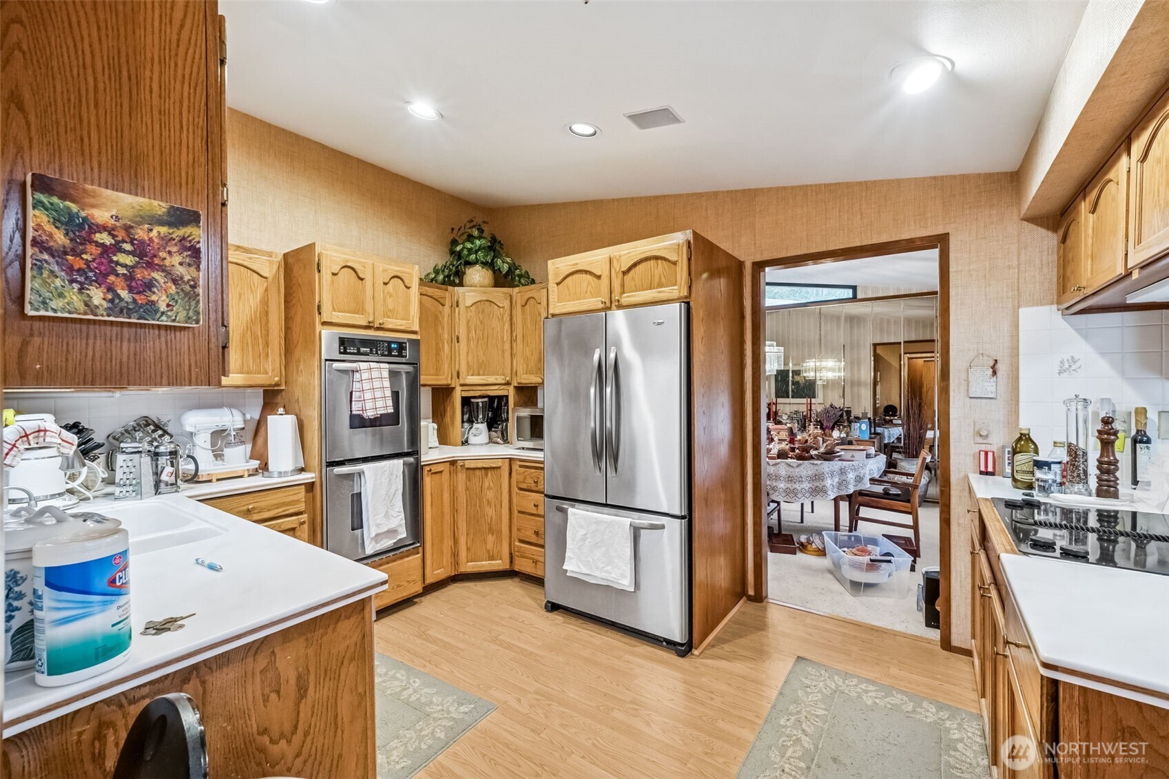 29722 Southeast Kent Kangley Road Ravensdale, WA 98051 - Photo 5 of 28 a kitchen with stainless steel appliances granite countertop a refrigerator and a sink