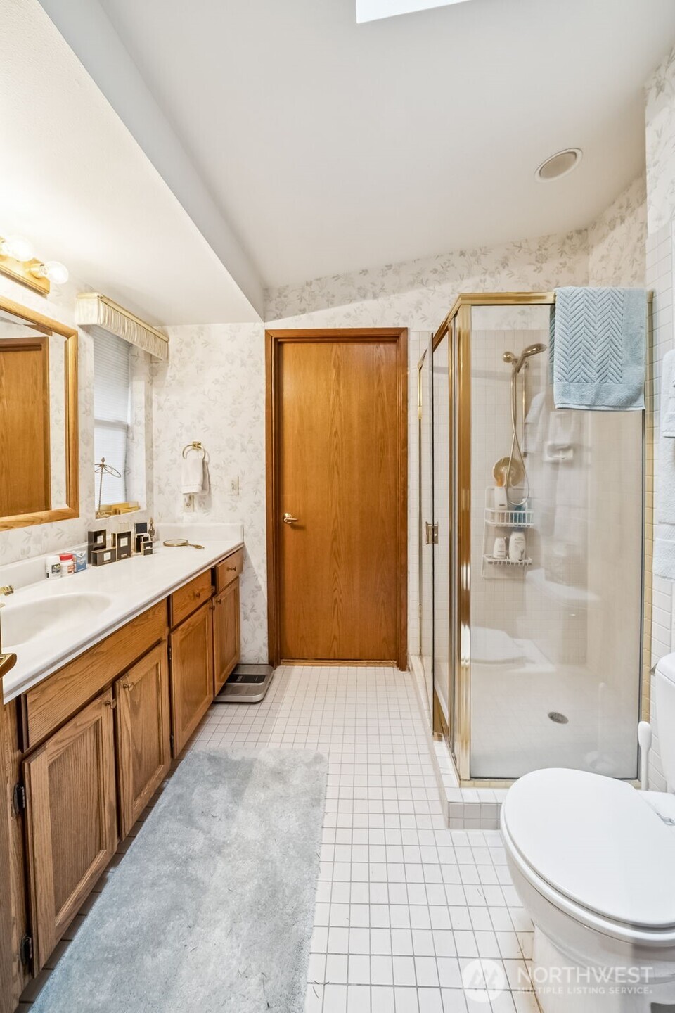 29722 Southeast Kent Kangley Road Ravensdale, WA 98051 - Photo 9 of 28 a spacious bathroom with a double vanity sink toilet mirror and shower