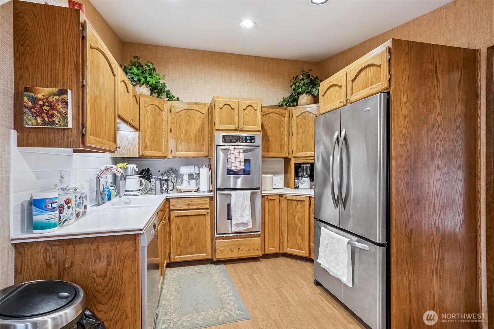 29722 Southeast Kent Kangley Road Ravensdale, WA 98051 - Photo 10 of 28 a kitchen with stainless steel appliances a refrigerator sink and stove