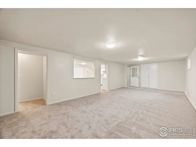 a view of a kitchen with wooden floor