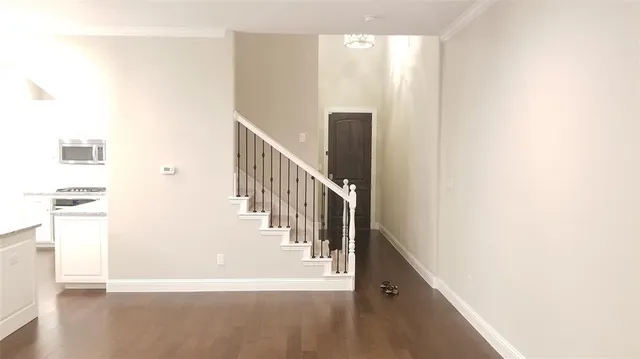 a view of a hallway with staircase