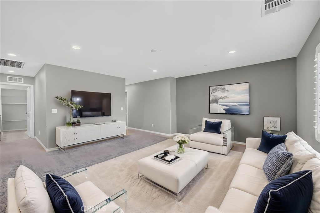 23347 Crystal Way Wildomar, CA 92595 - Photo 55 of 109 a living room with furniture and a flat screen tv