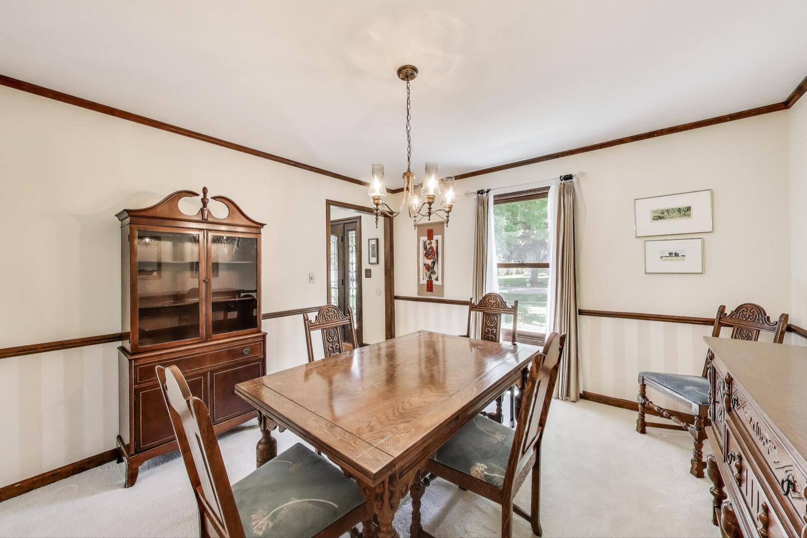 829 Shiloh Circle Naperville, IL 60540 - Photo 12 of 40 a view of a dining room with furniture window and wooden floor