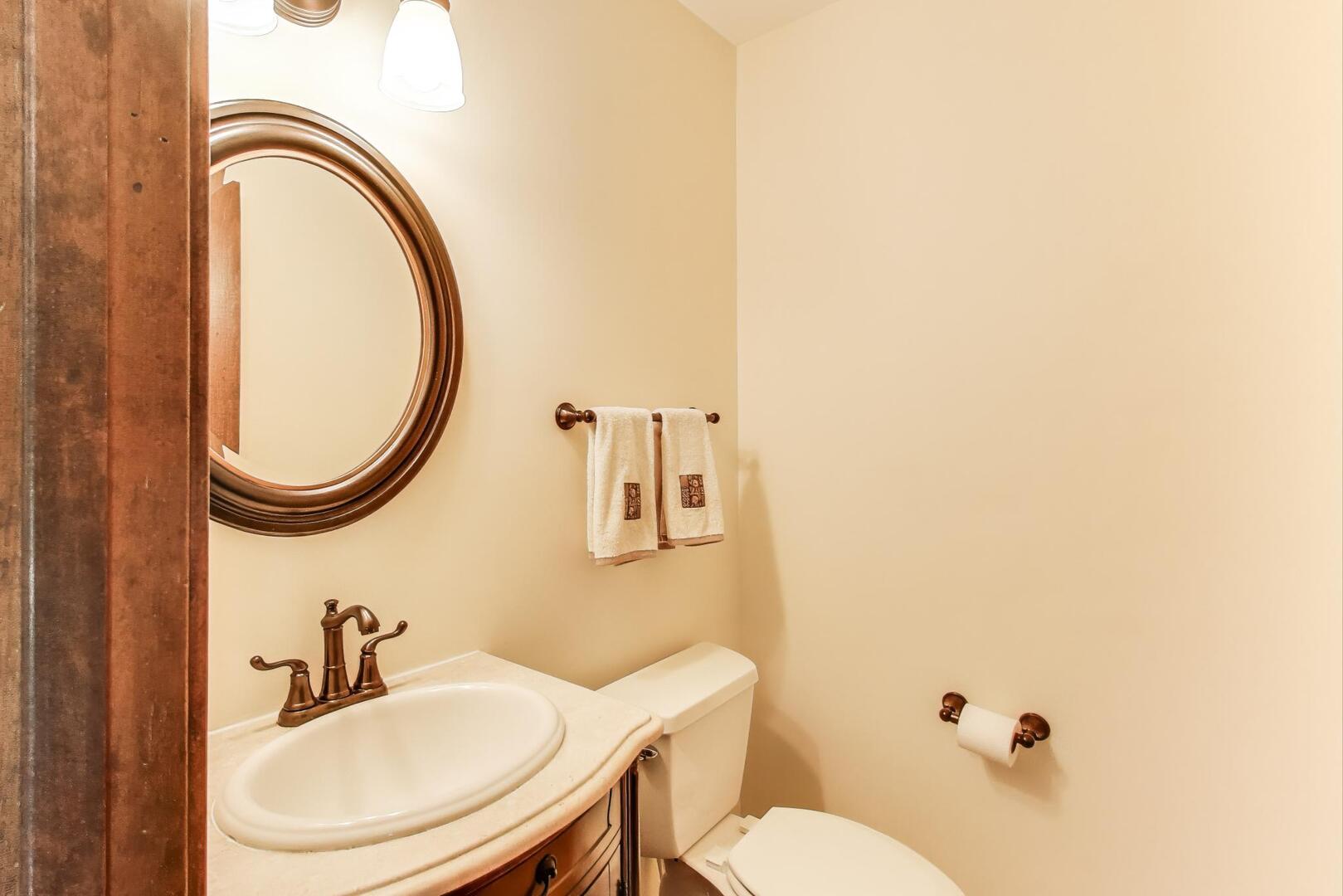 829 Shiloh Circle Naperville, IL 60540 - Photo 13 of 40 a bathroom with a toilet a sink and a mirror