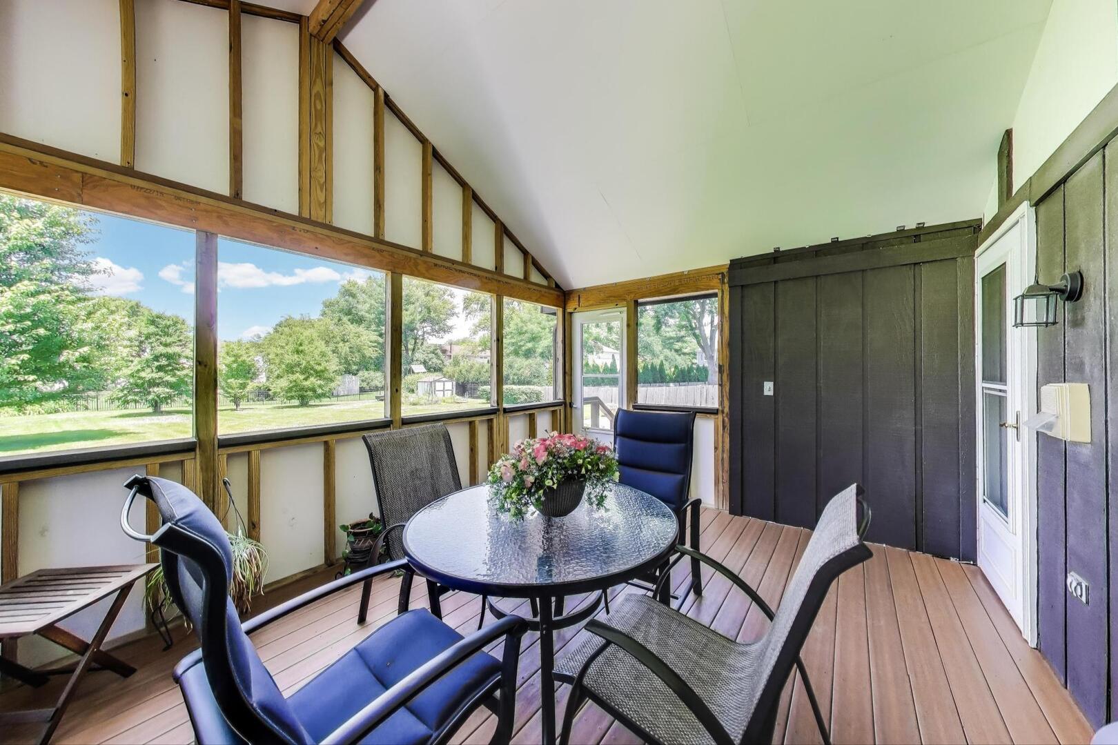 829 Shiloh Circle Naperville, IL 60540 - Photo 16 of 40 a view of a living room filled with furniture and window