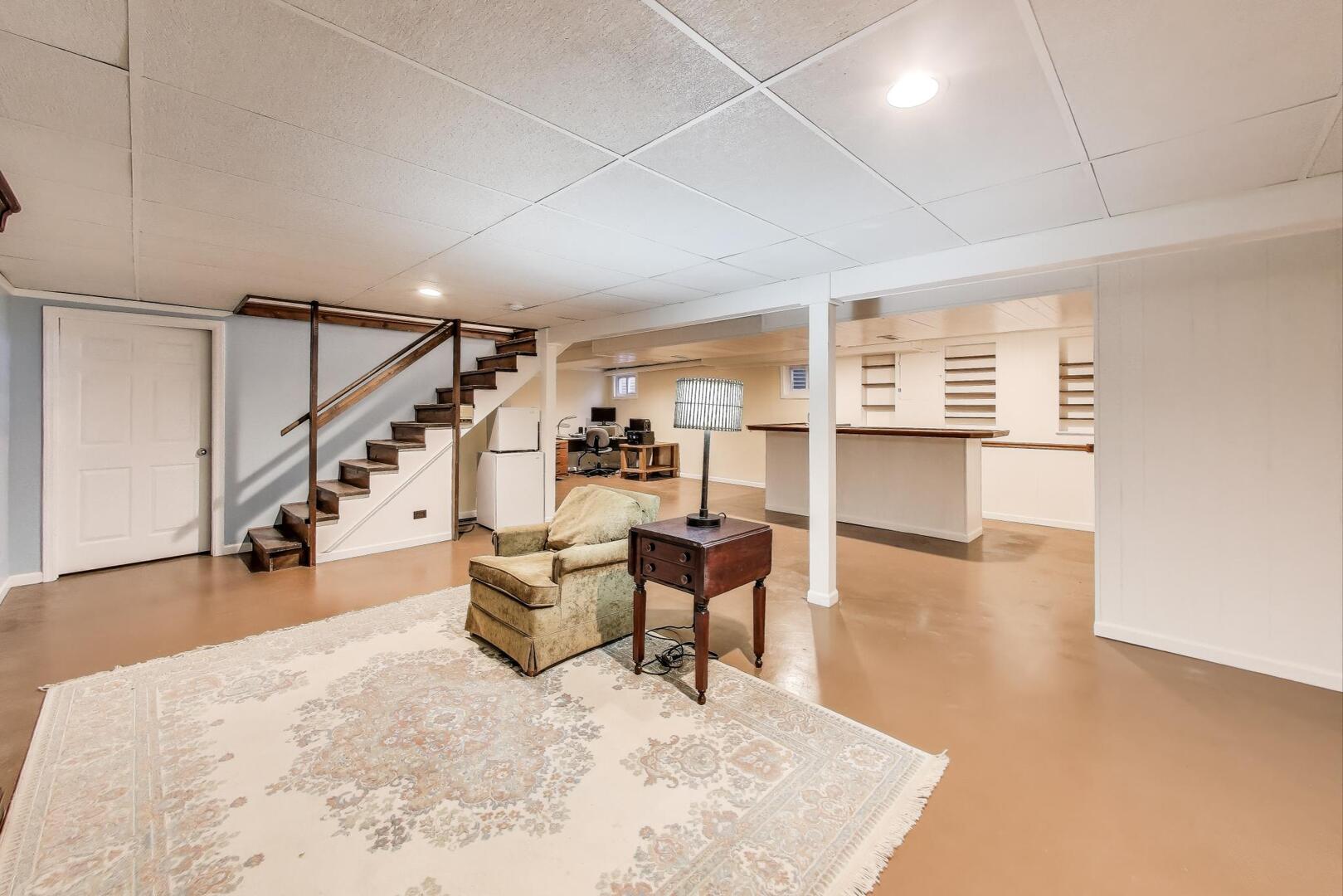 829 Shiloh Circle Naperville, IL 60540 - Photo 25 of 40 a view of a livingroom with furniture and stairs