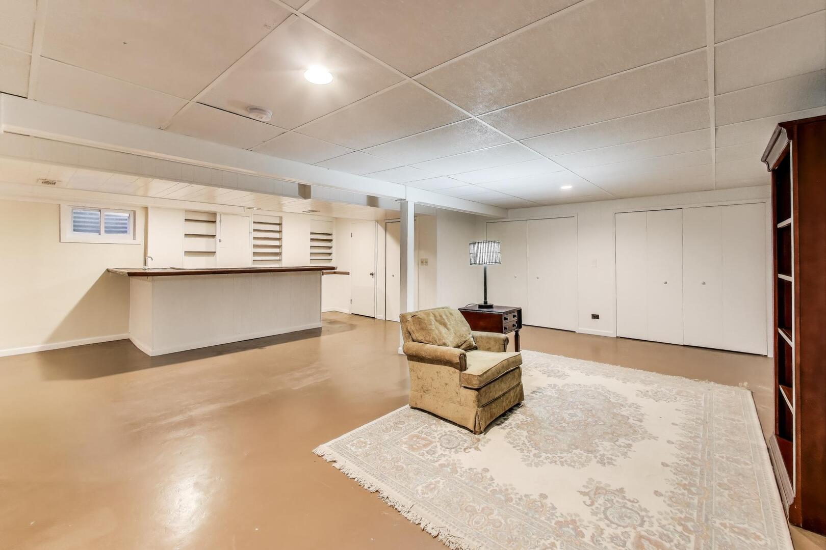 829 Shiloh Circle Naperville, IL 60540 - Photo 27 of 40 a living room with furniture and a flat screen tv