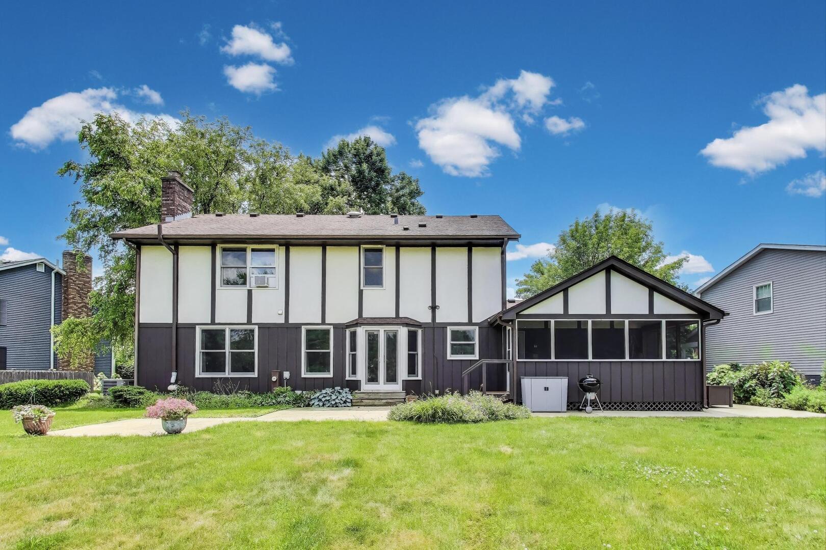 829 Shiloh Circle Naperville, IL 60540 - Photo 28 of 40 a view of a house with a swimming pool