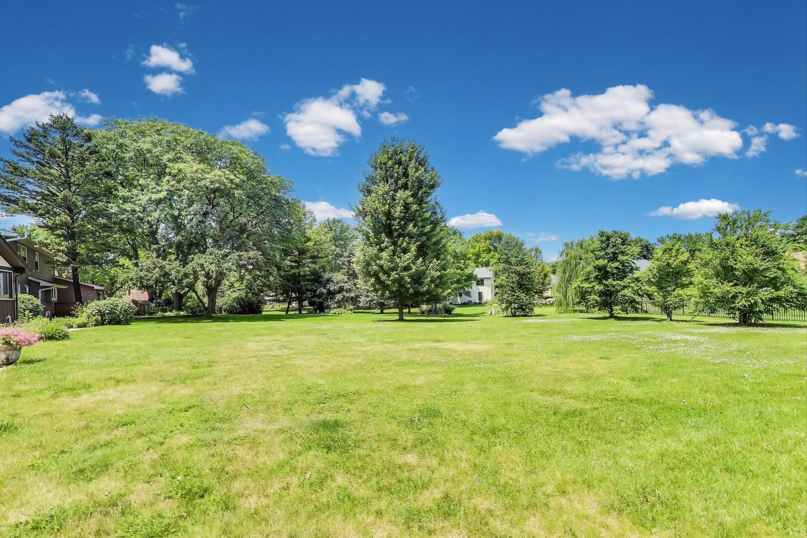 829 Shiloh Circle Naperville, IL 60540 - Photo 33 of 40 a view of a big yard with an outdoor space and seating
