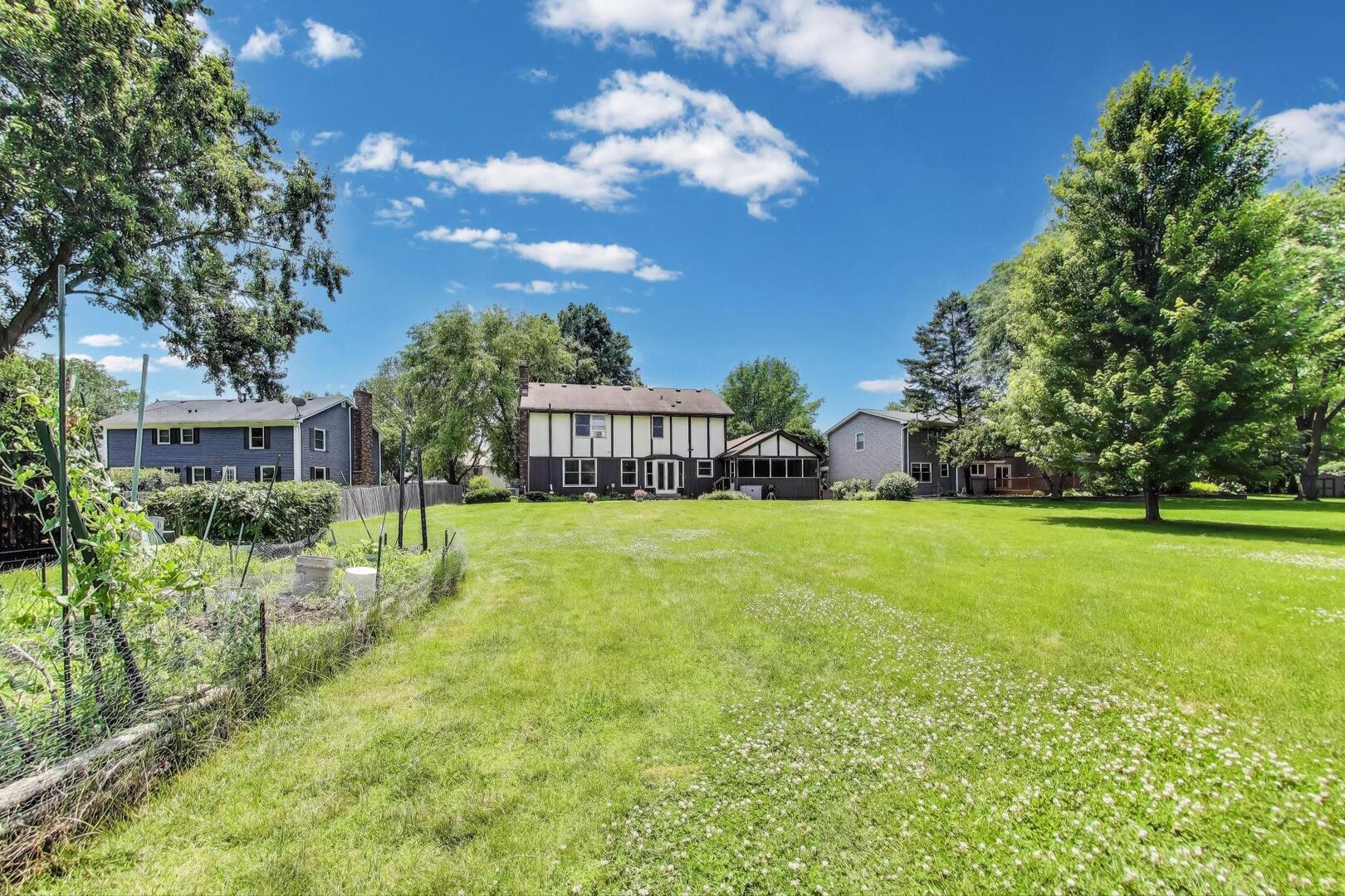 829 Shiloh Circle Naperville, IL 60540 - Photo 34 of 40 a view of house with garden space and trees