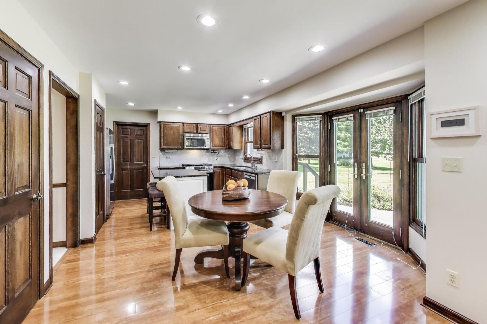 829 Shiloh Circle Naperville, IL 60540 - Photo 4 of 40 a view of a dining room with furniture window and wooden floor