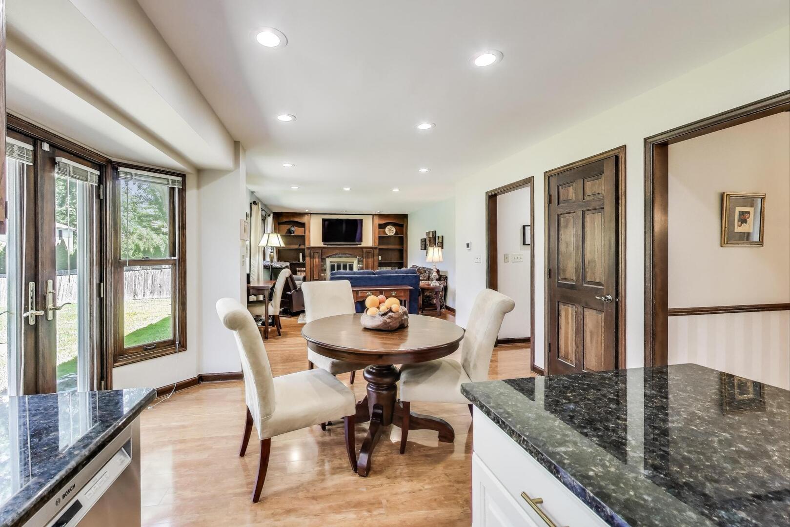 829 Shiloh Circle Naperville, IL 60540 - Photo 5 of 40 a dining room with furniture and a floor to ceiling window