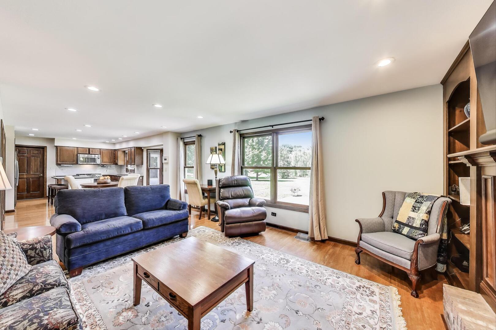 829 Shiloh Circle Naperville, IL 60540 - Photo 6 of 40 a living room with furniture and a large window