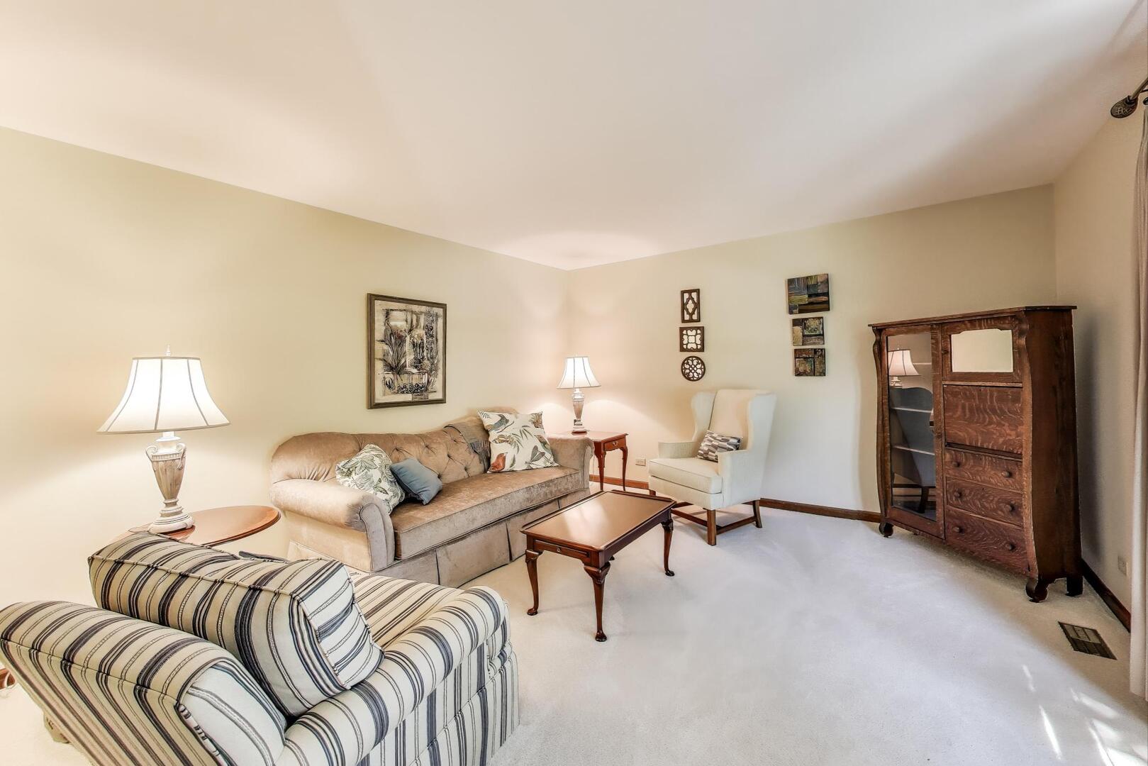 829 Shiloh Circle Naperville, IL 60540 - Photo 9 of 40 a living room with a couch and a window