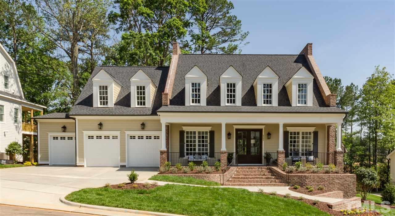 5208 Woodall Way, Unit 11 Raleigh, NC 27613 - Photo 1 of 25 front view of house with a yard