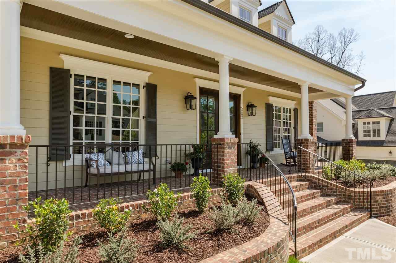 5208 Woodall Way, Unit 11 Raleigh, NC 27613 - Photo 2 of 25 a front view of a house with outdoor seating and plants