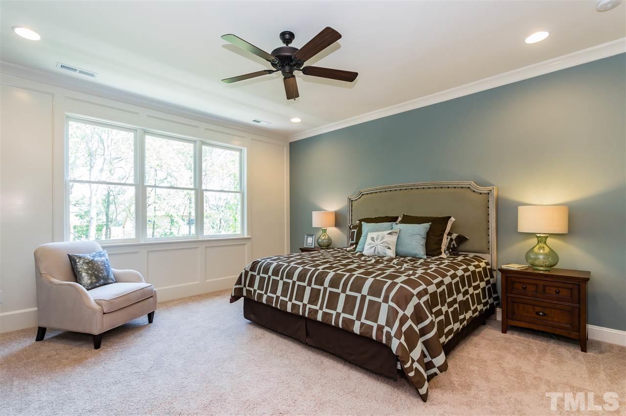 5208 Woodall Way, Unit 11 Raleigh, NC 27613 - Photo 13 of 25 a bedroom with a bed and a couch