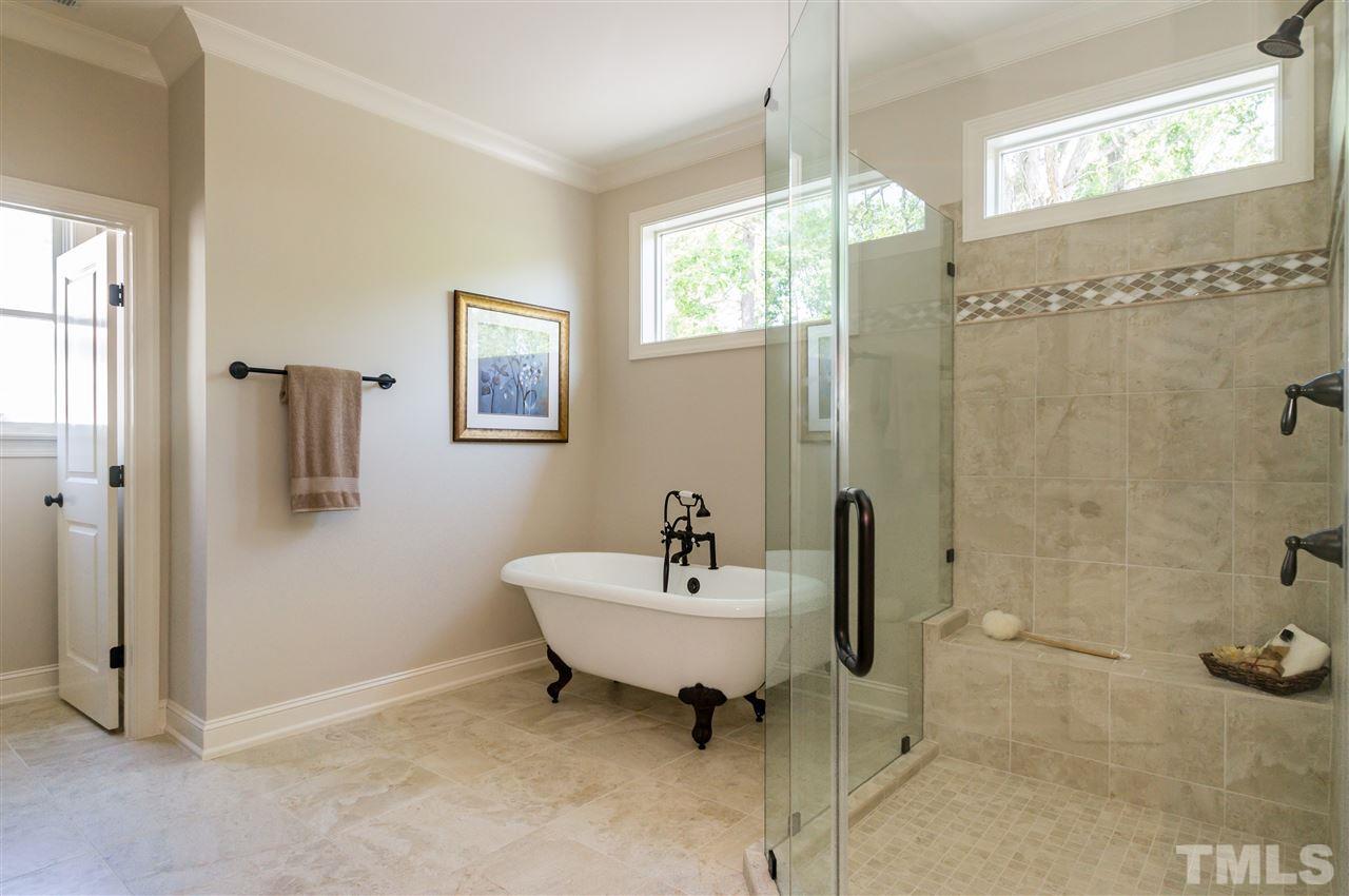 5208 Woodall Way, Unit 11 Raleigh, NC 27613 - Photo 16 of 25 a bathroom with a sink and a mirror