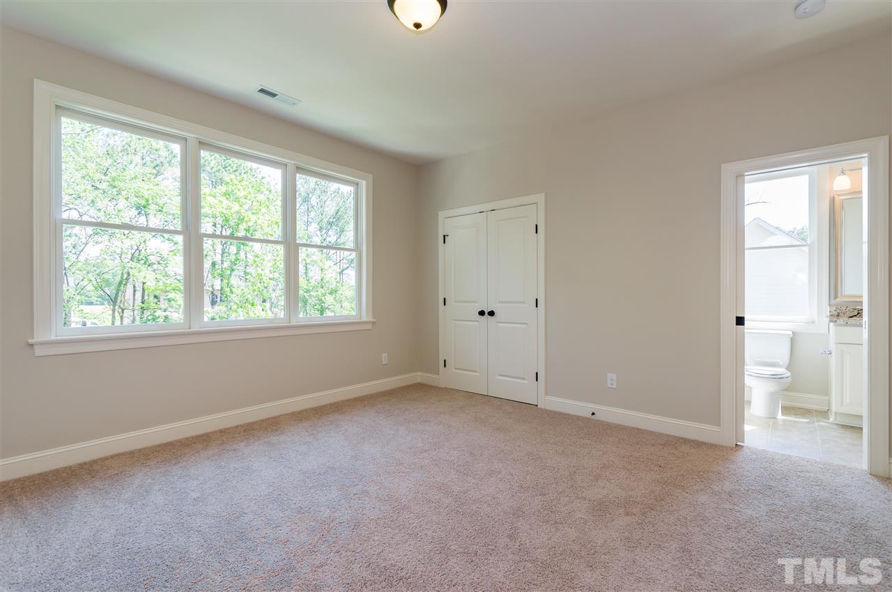 5208 Woodall Way, Unit 11 Raleigh, NC 27613 - Photo 19 of 25 a view of an empty room with a window