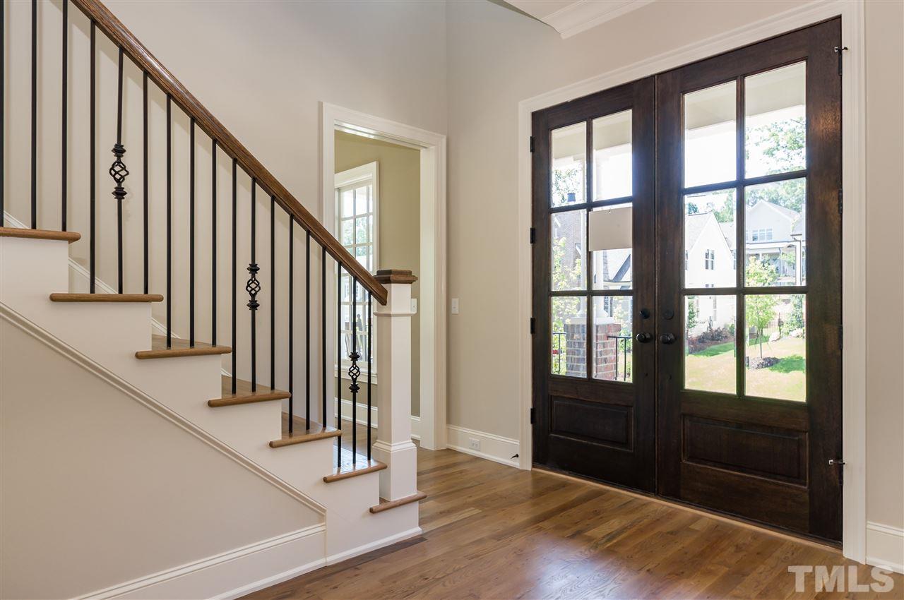 5208 Woodall Way, Unit 11 Raleigh, NC 27613 - Photo 3 of 25 a view of an entryway with wooden floor and door