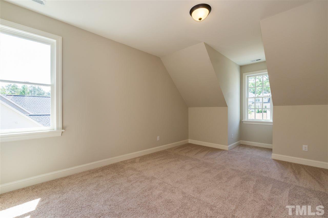 5208 Woodall Way, Unit 11 Raleigh, NC 27613 - Photo 21 of 25 an empty room with windows
