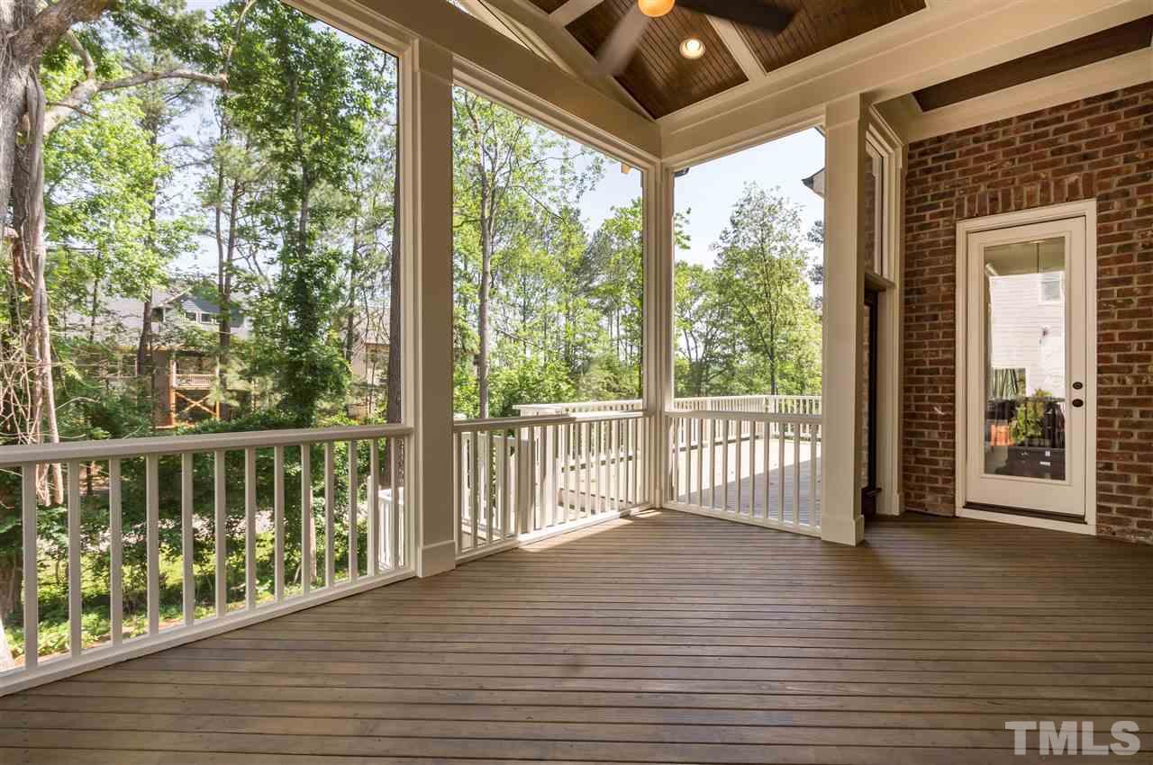 5208 Woodall Way, Unit 11 Raleigh, NC 27613 - Photo 23 of 25 a view of a porch with wooden floor and floor to ceiling window