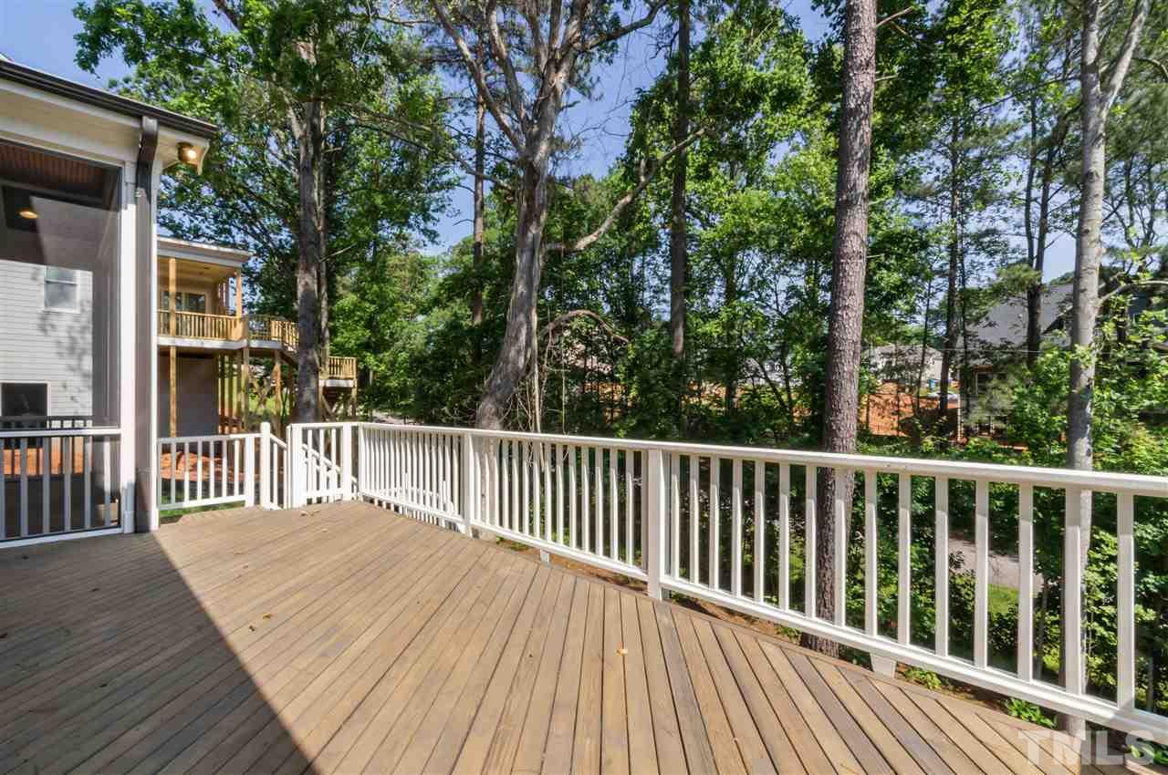 5208 Woodall Way, Unit 11 Raleigh, NC 27613 - Photo 24 of 25 a balcony with wooden floor and fence