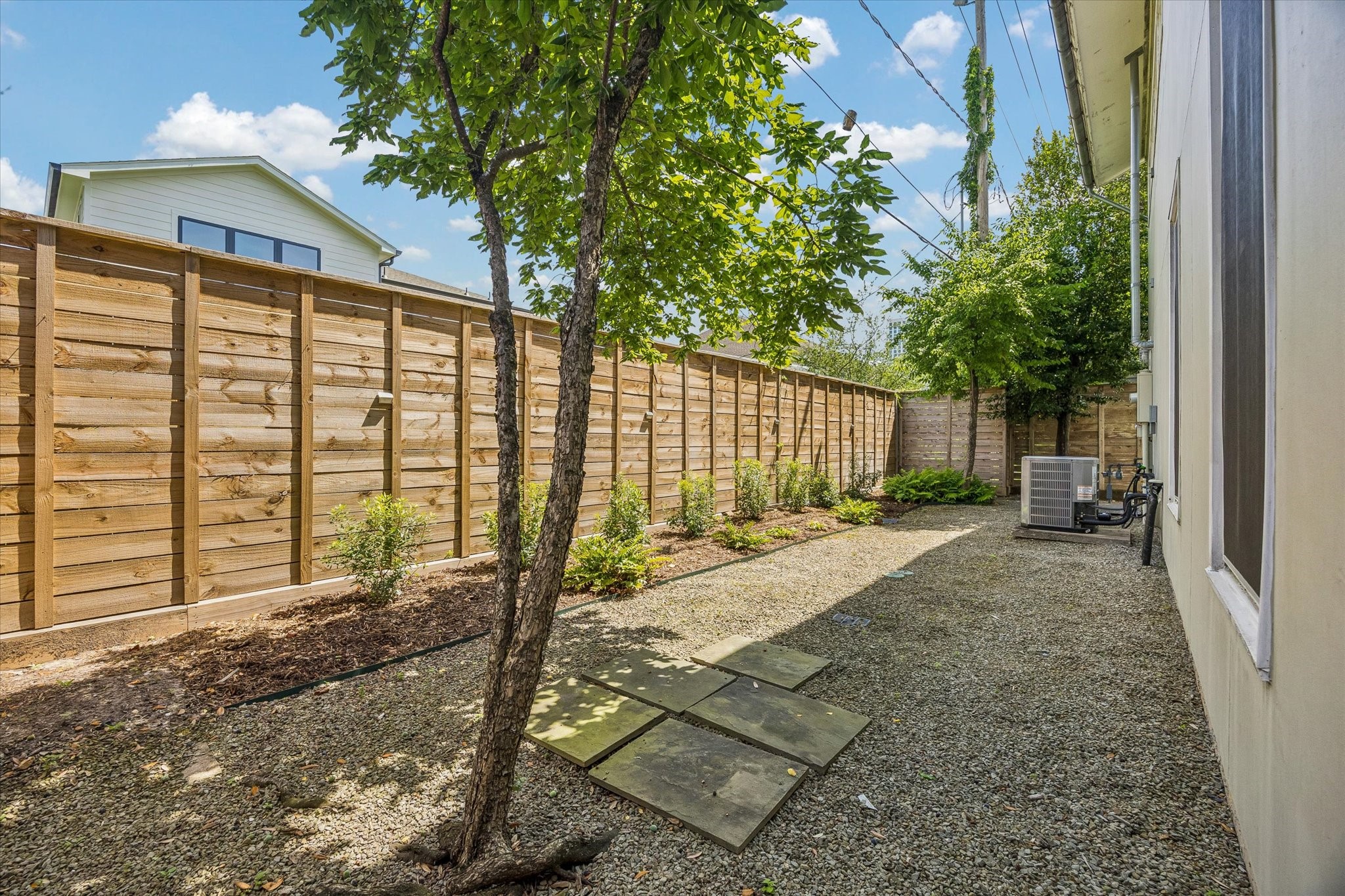 1418 Kipling Street Houston, TX 77006 - Photo 15 of 42 Private back yard space boast a new fence and recent HVAC unit. This space is nicely landscaped to be low maintenance.