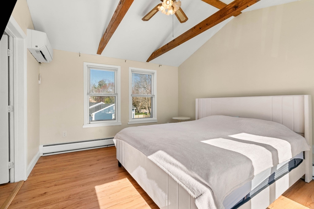 271 Broadway Haverhill, MA 01832 - Photo 22 of 41 a bedroom with a bed and a window