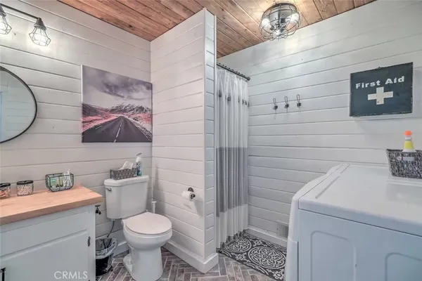 a bathroom with a toilet sink and shower