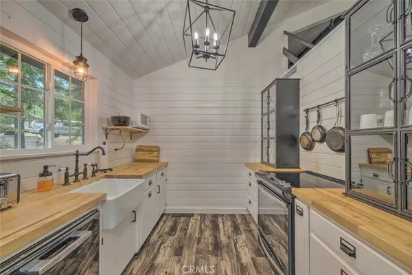 a kitchen that has a sink and a stove