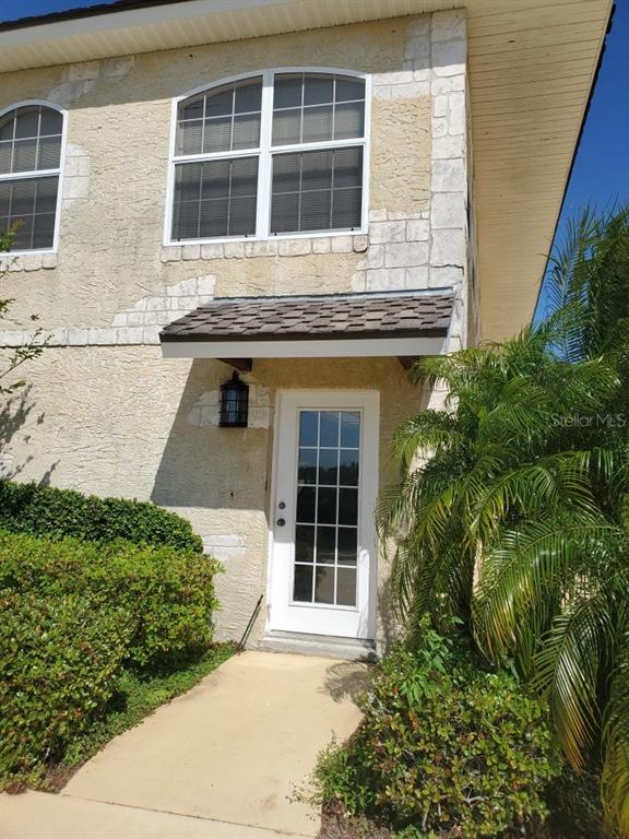 Undisclosed Address Umatilla, FL 32784 - Photo 1 of 9 a front view of a house with a garden