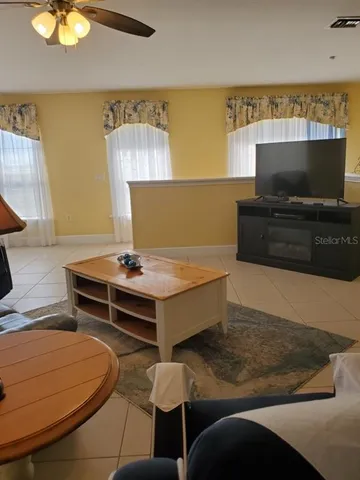 a living room with a flat screen tv and a couch
