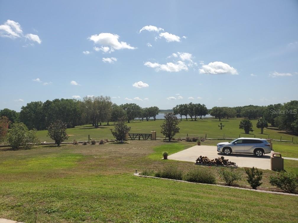 Undisclosed Address Umatilla, FL 32784 - Photo 9 of 9 a view of a lake with houses in the background