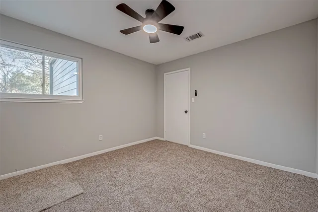 a bathroom with a bathtub and a toilet