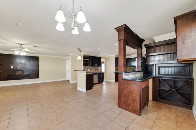 a kitchen with stainless steel appliances granite countertop a sink counter space and cabinets