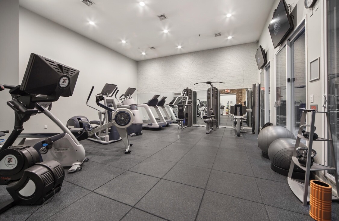 25 Murray Street, Unit 9B Manhattan, NY 10007 - Photo 11 of 15 a view of a room with gym equipment
