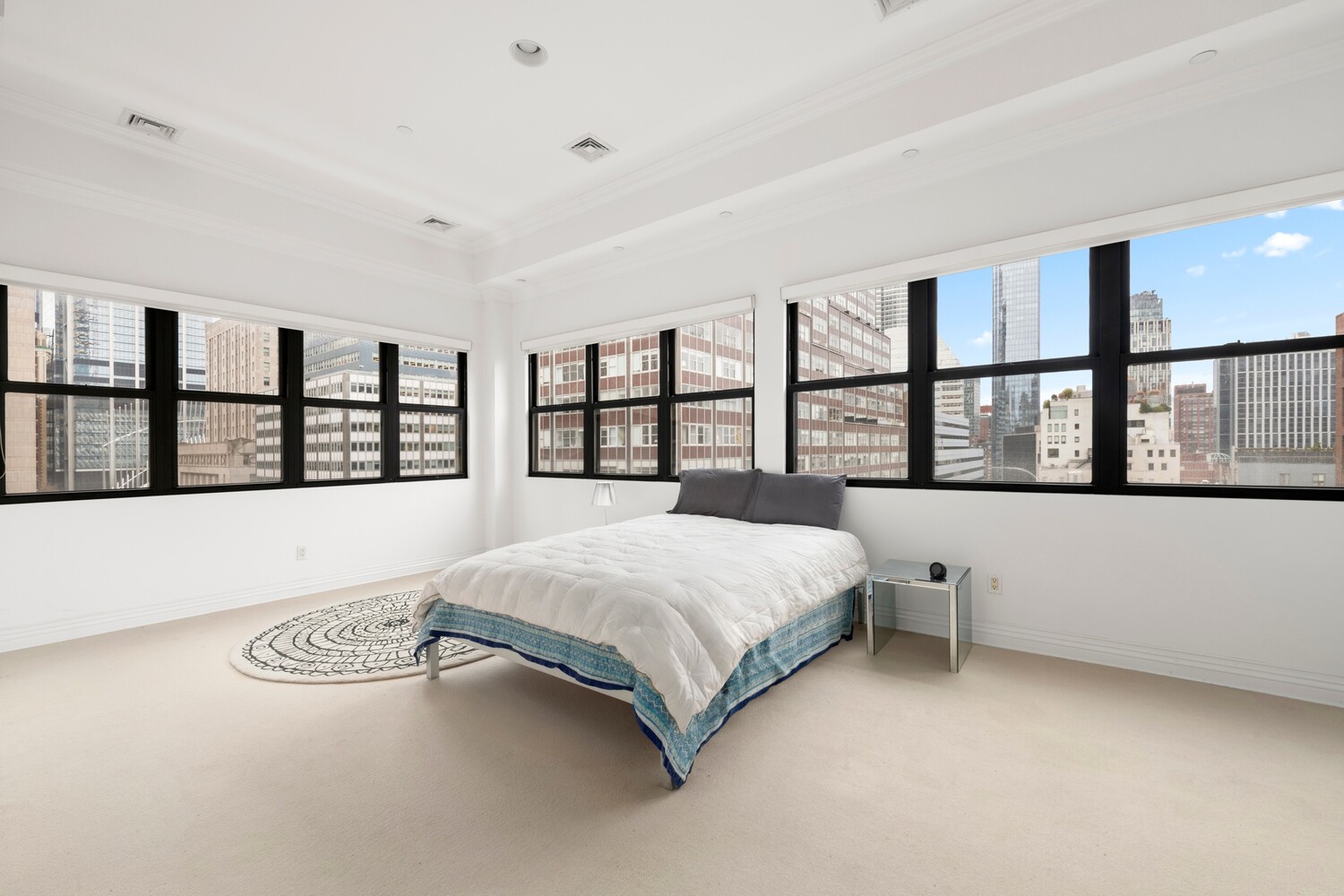 25 Murray Street, Unit 9B Manhattan, NY 10007 - Photo 5 of 15 a spacious bedroom with a large bed and a window