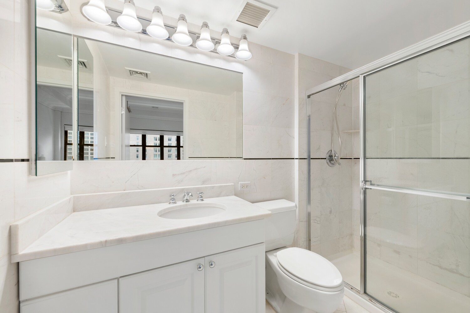 25 Murray Street, Unit 9B Manhattan, NY 10007 - Photo 8 of 15 a bathroom with a sink a toilet and shower