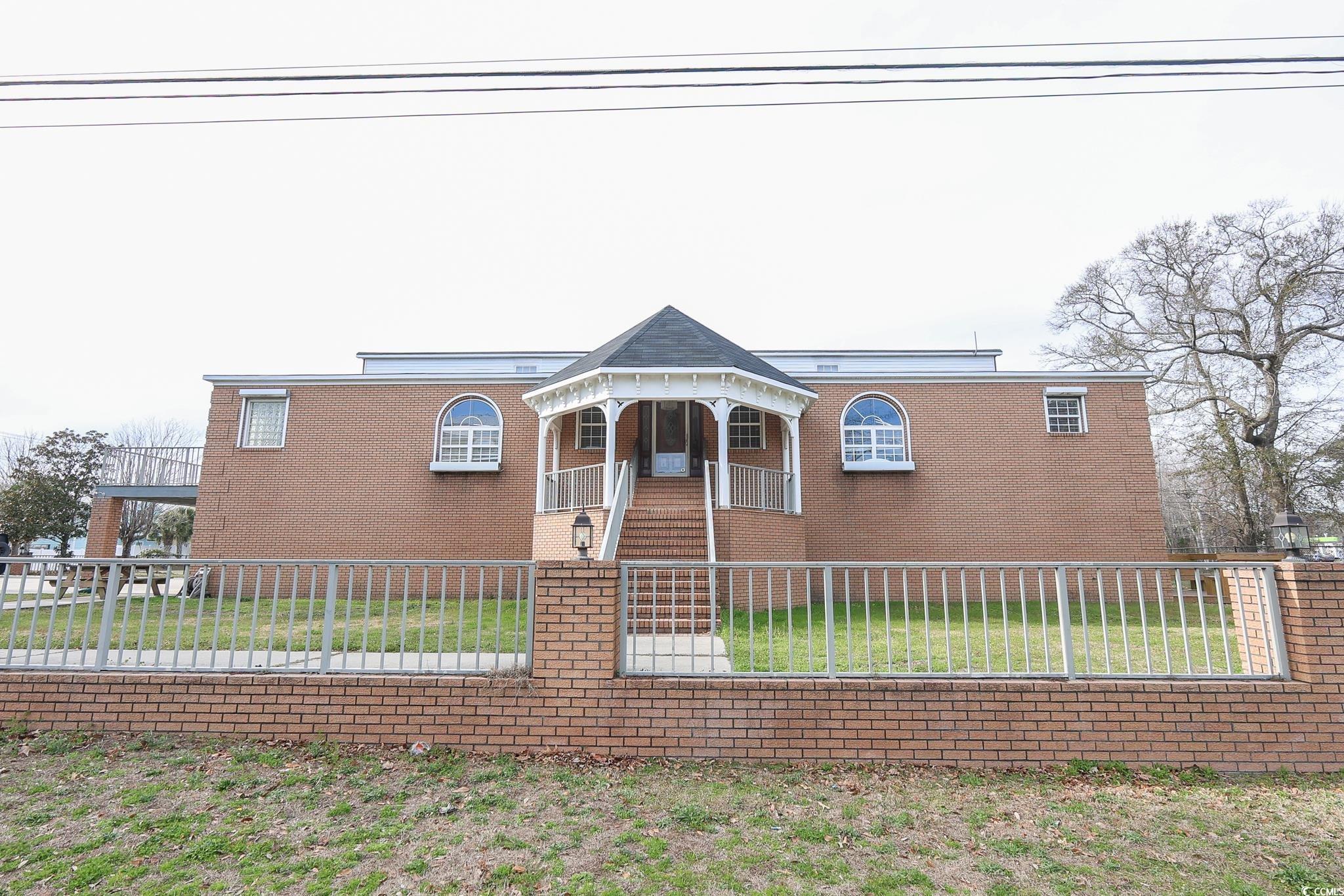 View of front of house with a front lawn