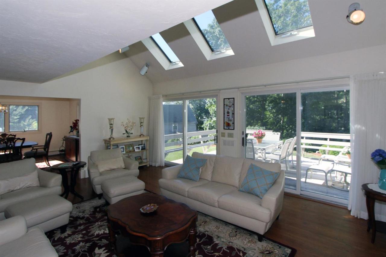 118 Elgin Road Pocasset, MA 02559 - Photo 11 of 35 a living room with furniture and a large window